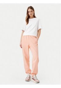 Adidas - adidas Spodnie dresowe Essentials JD1525 Różowy Loose Fit. Kolor: różowy. Materiał: bawełna