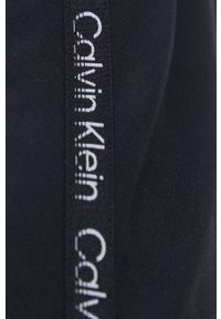 Calvin Klein Performance sukienka kolor czarny mini oversize. Kolor: czarny. Długość rękawa: długi rękaw. Wzór: aplikacja. Typ sukienki: oversize. Długość: mini #2