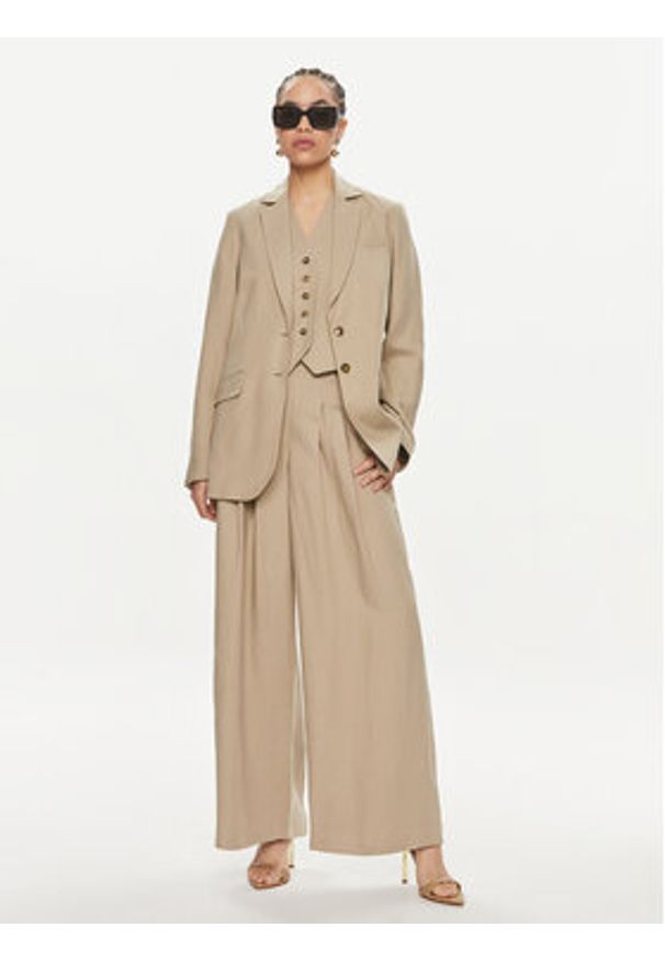 Herskind Spodnie materiałowe Lotus 5114840 Beżowy Relaxed Fit. Kolor: beżowy. Materiał: wiskoza