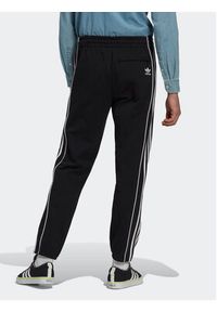 Adidas - adidas Spodnie dresowe Rekive HK7319 Czarny Regular Fit. Kolor: czarny. Materiał: bawełna, dresówka #6