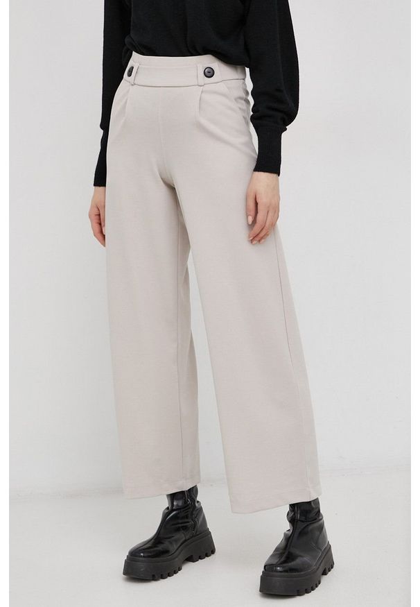 JDY Spodnie damskie kolor beżowy szerokie high waist. Stan: podwyższony. Kolor: beżowy. Materiał: tkanina