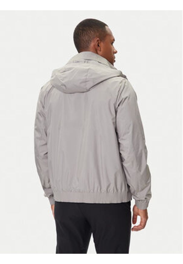 Calvin Klein Kurtka przejściowa LV04LC511G Beżowy Relaxed Fit. Kolor: beżowy. Materiał: syntetyk
