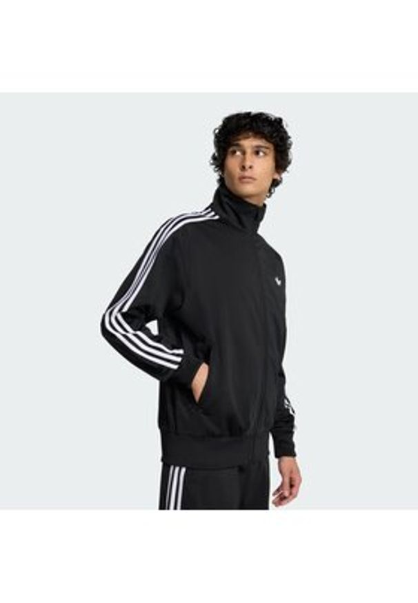 Adidas - adidas Bluza Firebird KD8312 Czarny Loose Fit. Kolor: czarny. Materiał: syntetyk