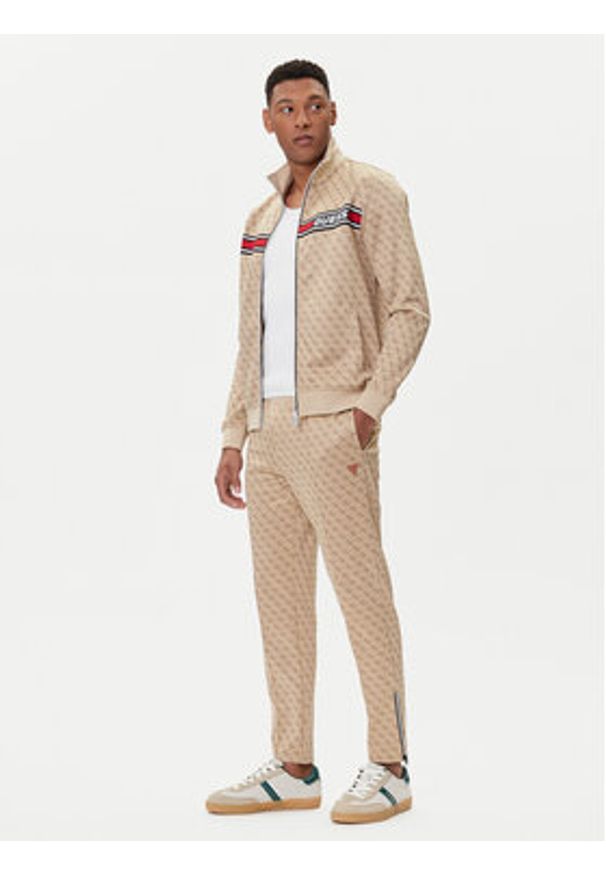Guess Spodnie dresowe Z2BB05 K7122 Beżowy Regular Fit. Kolor: beżowy. Materiał: bawełna, syntetyk