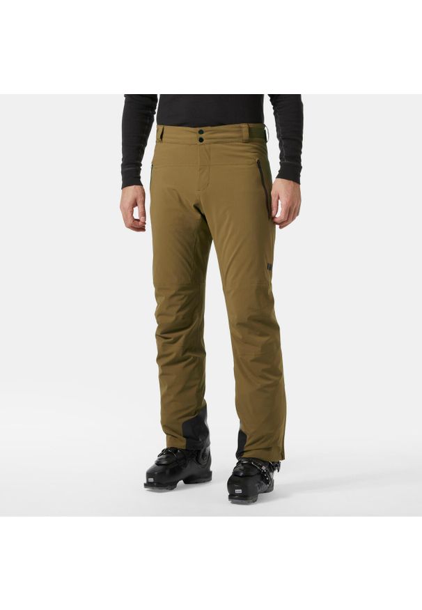Spodnie narciarskie Helly Hansen Alpha Lifaloft. Kolor: brązowy, beżowy, wielokolorowy. Sezon: zima. Sport: narciarstwo