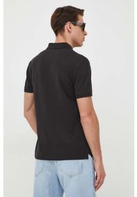 Calvin Klein Jeans polo męski kolor czarny z nadrukiem. Typ kołnierza: polo. Kolor: czarny. Materiał: dzianina. Długość: krótkie. Wzór: nadruk #3