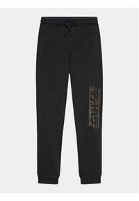 Guess Spodnie dresowe L3BQ12 KAD74 Czarny Relaxed Fit. Kolor: czarny. Materiał: bawełna #1