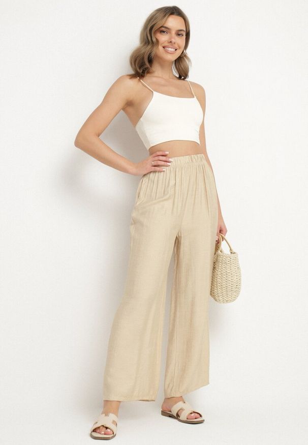 Born2be - Beżowe Szerokie Spodnie Typu Palazzo z Wysokim Stanem Varlevi. Okazja: na co dzień. Stan: podwyższony. Kolor: beżowy. Styl: casual, elegancki