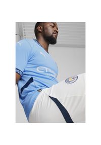 Puma - Męska koszulka domowa Manchester City 24/25 PUMA Team Light Blue Marine. Kolor: niebieski