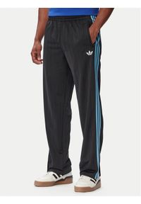 Adidas - adidas Spodnie dresowe Firebird Drop Needle KE4136 Czarny Regular Fit. Kolor: czarny. Materiał: syntetyk #1