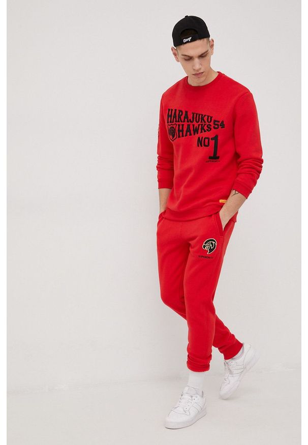Superdry spodnie dresowe męskie kolor czerwony z aplikacją. Kolor: czerwony. Materiał: dresówka. Wzór: aplikacja