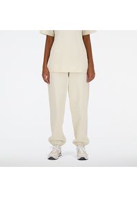 Spodnie damskie New Balance WP41513LIN – beżowe. Kolor: beżowy. Materiał: dresówka, bawełna