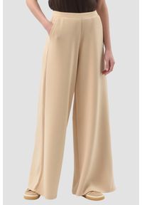 Guess - GUESS Beżowe damskie spodnie dresowe Olympe Wide Leg, Rozmiar XS. Kolor: beżowy. Materiał: dresówka #1