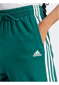 Adidas - adidas Spodnie dresowe Essentials 3-Stripes French Terry Loose-Fit Joggers IL3448 Zielony Loose Fit. Kolor: zielony. Materiał: bawełna