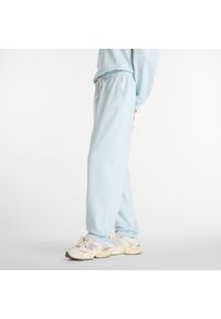 Spodnie damskie New Balance WP41513FRL – niebieskie. Stan: podwyższony. Kolor: niebieski. Materiał: bawełna, dresówka. Wzór: ze splotem #4