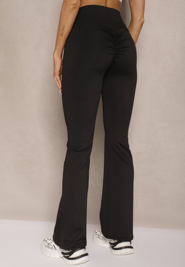 Renee - Czarne Legginsy Dzwony High Waist Orruvana. Stan: podwyższony. Kolor: czarny. Materiał: tkanina