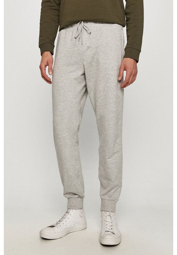 Guess - Spodnie. Kolor: szary. Materiał: dzianina. Wzór: gładki