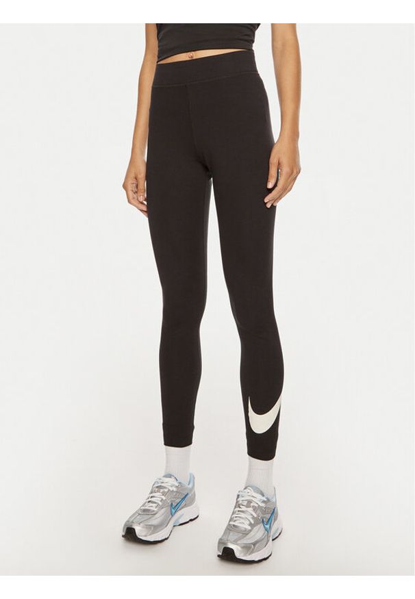 Nike Legginsy DV7795 Czarny Tight Fit. Kolor: czarny. Materiał: bawełna, syntetyk