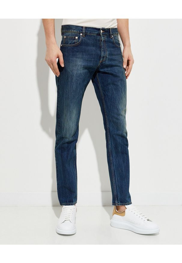 Alexander McQueen - ALEXANDER MCQUEEN - Granatowe jeansy z przetarciami. Kolor: niebieski