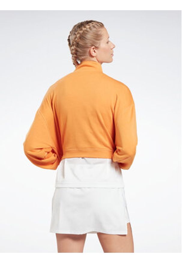 Reebok Bluza Workout Ready HT6043 Pomarańczowy Relaxed Fit. Kolor: pomarańczowy. Materiał: bawełna