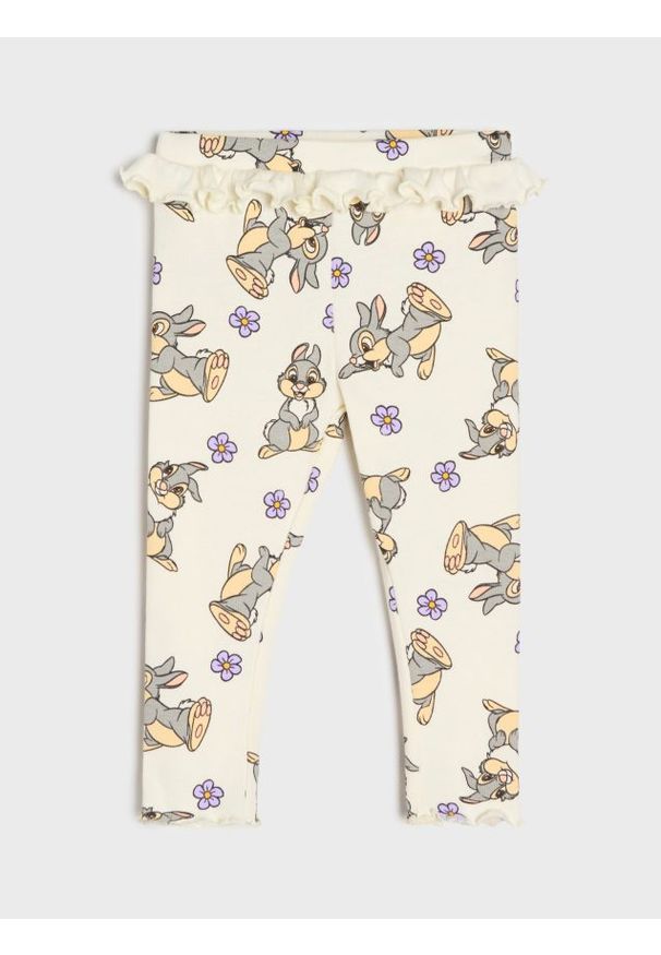 Sinsay - Prążkowane legginsy z falbanką Disney - kremowy. Kolor: kremowy. Materiał: prążkowany. Wzór: motyw z bajki