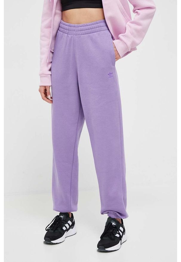 adidas Originals spodnie dresowe kolor fioletowy gładkie. Stan: podwyższony. Kolor: fioletowy. Materiał: dresówka. Wzór: gładki
