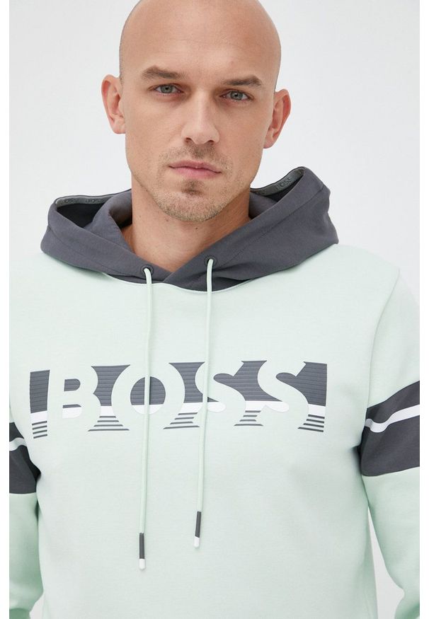 BOSS bluza BOSS ATHLEISURE męska kolor zielony z kapturem z nadrukiem. Typ kołnierza: kaptur. Kolor: zielony. Materiał: dzianina. Wzór: nadruk