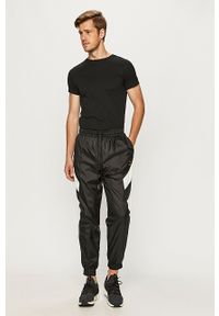 Puma - Spodnie. Kolor: czarny. Materiał: tkanina #2