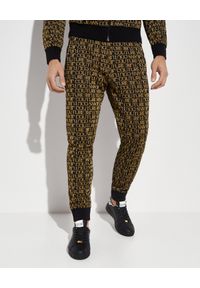 Versace Jeans Couture - VERSACE JEANS COUTURE - Spodnie dresowe z nadrukami logo. Kolor: czarny. Materiał: dresówka. Wzór: nadruk