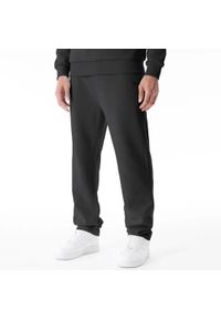 Spodnie do biegania New Era. Kolor: czarny. Materiał: dresówka. Długość: długie. Wzór: haft #1