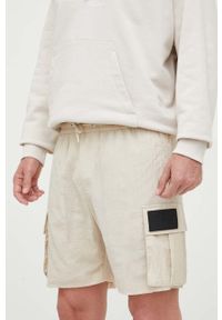 Calvin Klein Jeans szorty męskie kolor beżowy. Kolor: beżowy. Materiał: tkanina #1