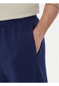 Adidas - adidas Spodnie dresowe Collegiate JM9179 Niebieski Regular Fit. Kolor: niebieski. Materiał: bawełna