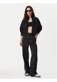 Adidas - adidas Spodnie dresowe Satin Sst KS9372 Czarny Loose Fit. Kolor: czarny. Materiał: syntetyk #3