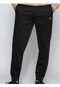 Sinsay - Spodnie dresowe jogger - czarny. Kolor: czarny. Materiał: dresówka #1