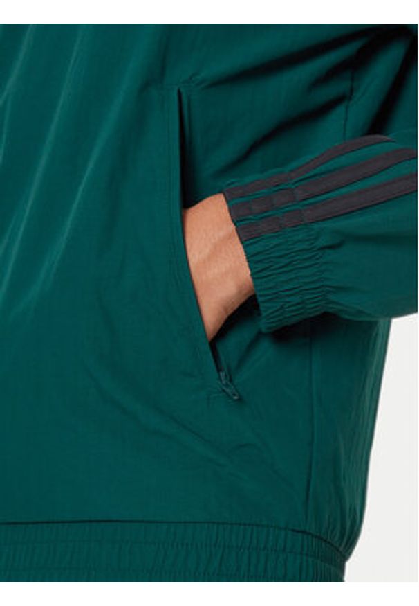 Adidas - adidas Bluza adicolor Woven Firebird JY1329 Zielony Loose Fit. Kolor: zielony. Materiał: syntetyk