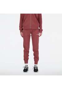 Spodnie damskie New Balance WP03805WAD – różowe. Kolor: różowy. Materiał: dresówka, bawełna, poliester. Wzór: haft