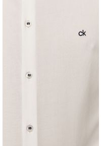 Calvin Klein - Koszula bawełniana. Typ kołnierza: kołnierzyk klasyczny. Kolor: biały. Materiał: bawełna. Długość rękawa: długi rękaw. Długość: długie. Wzór: gładki. Styl: elegancki, klasyczny #2