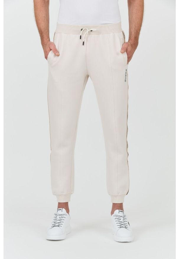 Guess - GUESS Beżowe męskie spodnie Mickey Cuff Pant, Rozmiar S. Kolor: beżowy