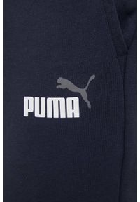 Puma spodnie 586768 męskie kolor granatowy gładkie. Kolor: niebieski. Materiał: materiał, dzianina. Wzór: gładki #2