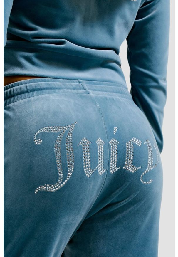 Juicy Couture - JUICY COUTURE Niebieskie damskie spodnie dresowe Tina Trackpants. Kolor: niebieski. Materiał: dresówka