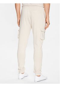 Ellesse Spodnie dresowe Labico SHR17718 Beżowy Regular Fit. Kolor: beżowy. Materiał: bawełna, dresówka
