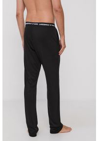 Karl Lagerfeld Spodnie piżamowe 215M2182 męskie kolor czarny gładkie. Kolor: czarny. Materiał: bawełna, materiał, dzianina, lyocell, tkanina, jedwab. Wzór: gładki #3