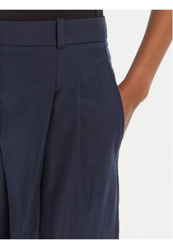 Hugo - HUGO Spodnie materiałowe Harenau 50542606 Granatowy Relaxed Fit. Kolor: niebieski. Materiał: bawełna