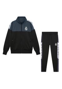 Dres piłkarski dziecięcy Real Madrid 23/24. Kolor: czarny. Materiał: dresówka. Styl: sportowy
