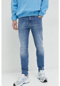 Tommy Jeans jeansy Simon męskie. Kolor: niebieski #1
