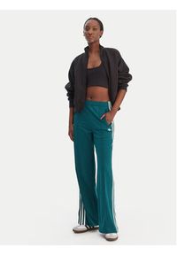Adidas - adidas Spodnie dresowe Firebird KG3701 Zielony Loose Fit. Kolor: zielony. Materiał: syntetyk #3