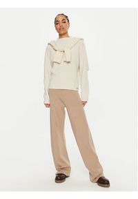 Calvin Klein Spodnie dresowe K20K207680 Beżowy Relaxed Fit. Kolor: beżowy. Materiał: wełna