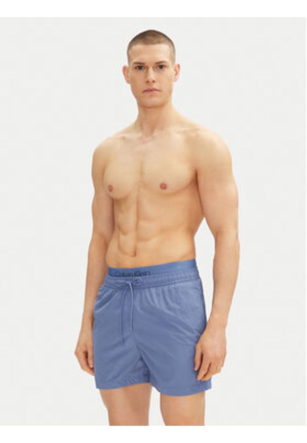 Calvin Klein Swimwear Szorty kąpielowe KM0KM01104 Niebieski Regular Fit. Kolor: niebieski. Materiał: syntetyk