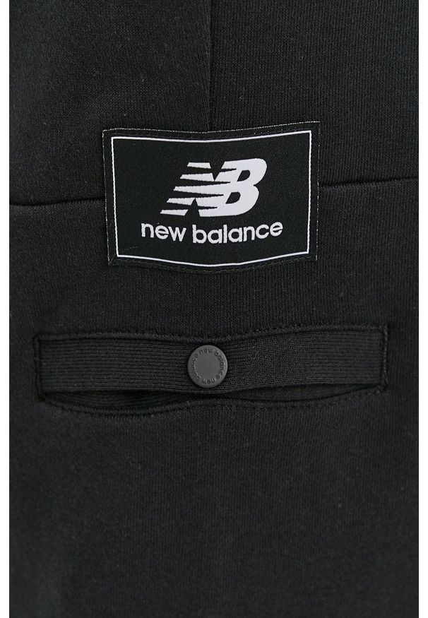 New Balance - Spodnie. Kolor: czarny. Materiał: dzianina. Wzór: gładki