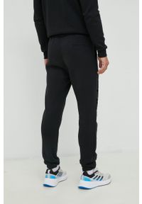 Adidas - adidas spodnie dresowe kolor czarny z aplikacją. Kolor: czarny. Materiał: dresówka. Wzór: aplikacja #3